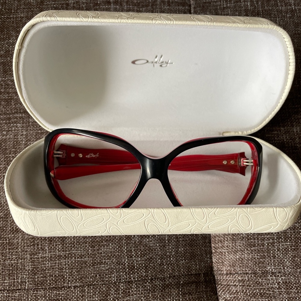 Red and black Oakley Betray sunglass fames and original case